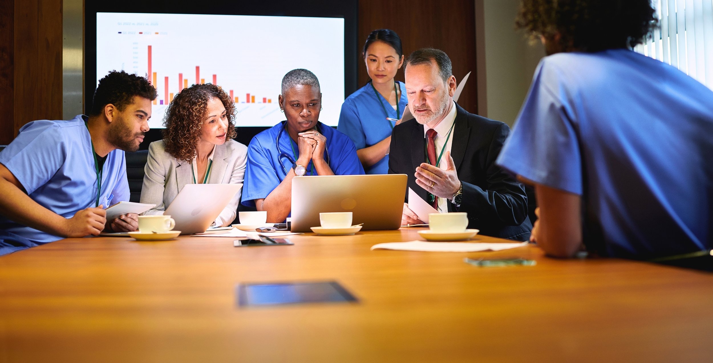 Healthcare operations team reviewing a licensing dashboard